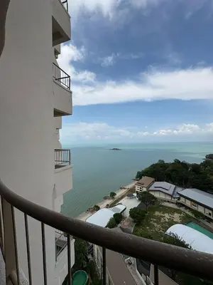 a view of the ocean from the balcony of a hotel at Rainbow deluxe seaview in Tanjung Bungah