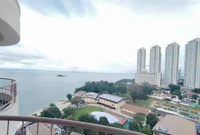 a view of the ocean from a balcony of a city at 17 Jazz sweet beachfront resort in Tanjung Bungah