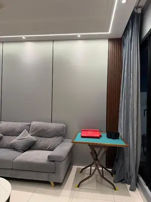 a living room with a couch and a table at Villa 8812 \u6781\u7b80\u98ce\u6c11\u5bbf \u8212\u9002\u73b0\u4ee3\u98ce in Kampong Sungai Udang