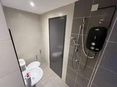 a bathroom with a shower with a toilet and a sink at Villa 8812 \u6781\u7b80\u98ce\u6c11\u5bbf \u8212\u9002\u73b0\u4ee3\u98ce in Kampong Sungai Udang