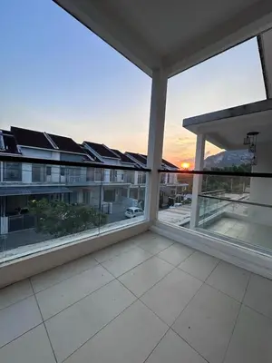 an empty balcony with large windows in a building at Ipoh Sunway Tambun Spacious Homestay in Ipoh