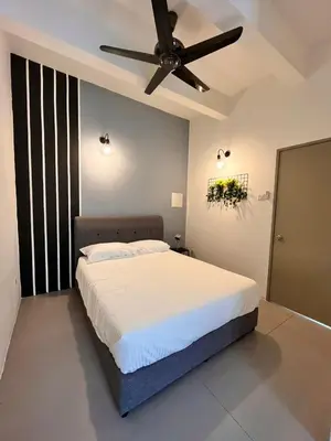 a bedroom with a bed with a ceiling fan at Aloft Cameron Highlands B in Brinchang