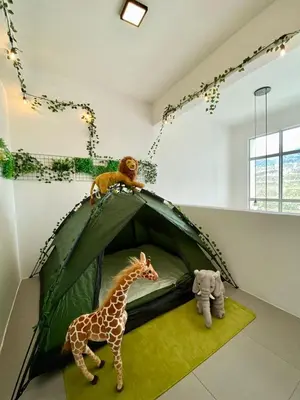 a toy giraffe and an elephant in a tent at Aloft Cameron Highlands B in Brinchang