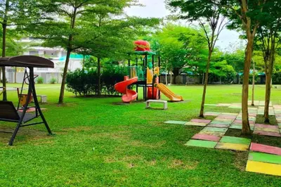 a playground with a slide in a park at Comfy Home Near to SPICE and USM in Bayan Lepas