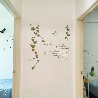 a wall with a brick wall with butterflies on it at Comfy Home Near to SPICE and USM in Bayan Lepas