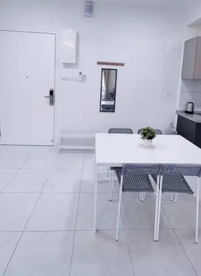 a white room with a table and chairs and a door at TheSun #Studio #BayanLepas #Pisa in Kampong Manggis