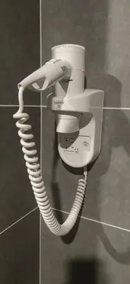 a phone hanging on a wall in a bathroom at H&W Sunway Onsen Suites Services Tambun Ipoh S-07-05 in Ipoh