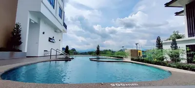 a swimming pool in the middle of a building at H&W Sunway Onsen Suites Services Tambun Ipoh S-07-05 in Ipoh