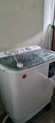 a white stove top sitting in a room at D'HutHomestay Puncak Iskandar in Seri Iskandar