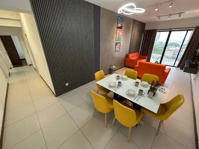 a dining room with a table and yellow chairs at NEW 4Queen Bed 3 Room 2CP near Gurney with tvbox and KTV Set in Tanjong Tokong