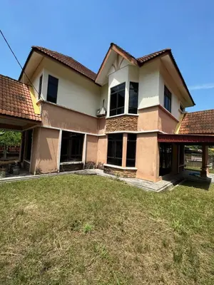 a house with a large yard in front of it at GS HOMESTAY WHOLE VILLA in Bayan Lepas