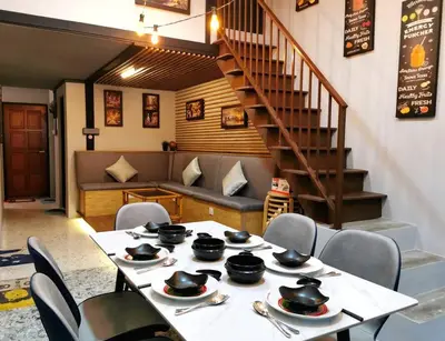 a table with plates and bowls on top of it at English comfort house in ipoh by SuccessWisdom\u5ea6\u5047\u667a\u5bcc in Ipoh