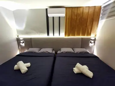 two pillows on a bed in a room at English comfort house in ipoh by SuccessWisdom\u5ea6\u5047\u667a\u5bcc in Ipoh