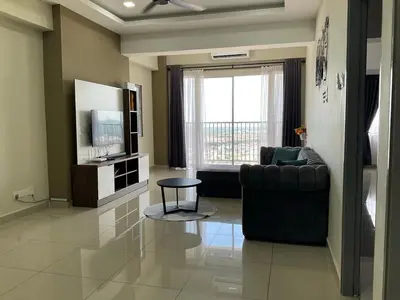 a living room with a couch and a television at Sweet Homestay The Venus Sitiawan \u6e29\u99a8\u6c11\u5bbf in Sitiawan