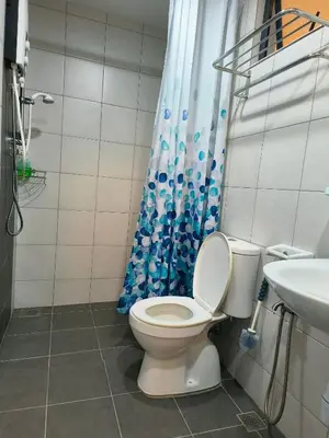 a bathroom with a toilet and a sink at New The Sun Homestay at Sg Nibong nearby Queensbay or PISA or FTZ Bayan Lepas HENG in Bayan Lepas