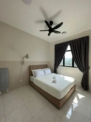 a bedroom with a bed with a ceiling fan at New The Sun Homestay at Sg Nibong nearby Queensbay or PISA or FTZ Bayan Lepas HENG in Bayan Lepas