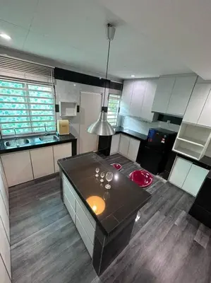 a kitchen with a island in the middle of a room at Ipoh Luxury Spacious Corner Home in Ipoh