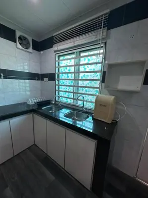 a small kitchen with a sink and a window at Ipoh Luxury Spacious Corner Home in Ipoh