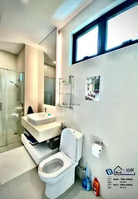 a bathroom with a toilet and a sink and a shower at Batu Ferringhi Luxurious Modern Designed 5BR House in Batu Ferringhi
