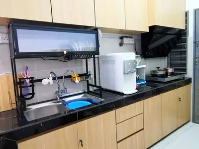 a kitchen with a sink and a microwave at Hygge Living Kampar (Near UTAR) in Kampar
