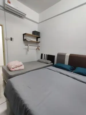 a bedroom with two beds in a room at Hygge Living Kampar (Near UTAR) in Kampar