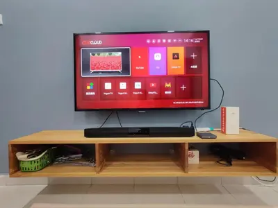 a flat screen tv sitting on a wooden shelf at Hygge Living Kampar (Near UTAR) in Kampar