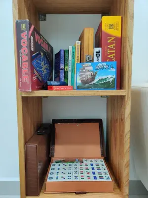 a wooden book shelf with a laptop in a box at Hygge Living Kampar (Near UTAR) in Kampar