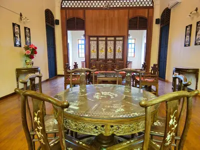 a dining room with a glass table and chairs at The Century Hotel George Town \u4e54\u6cbb\u5e02\u4e16\u7eaa\u9152\u5e97 in George Town