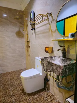 a bathroom with a sink and a toilet and a mirror at The Century Hotel George Town \u4e54\u6cbb\u5e02\u4e16\u7eaa\u9152\u5e97 in George Town