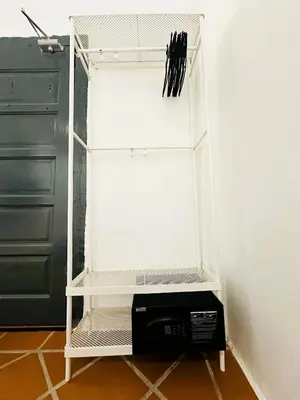a refrigerator with its door open with a microwave inside at The Century Aigoh Hotel in George Town