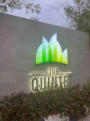 a sign for the quattro in front of a building at Lucky Home @ Quintet Tanah Rata in Cameron Highlands