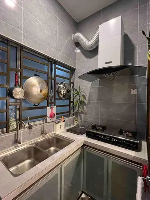 a kitchen with a sink and a stove at Lucky Home @ Quintet Tanah Rata in Cameron Highlands
