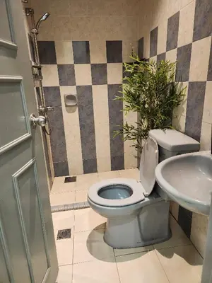 a bathroom with a toilet and a sink at Galaxy Guest Home by Ipoh Maju Stay in Ipoh