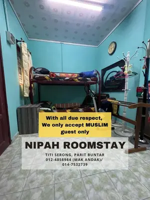 a hospital room with a sign that reads nirrhrothrothritis at NIPAH ROOMSTAY PARIT BUNTAR in Parit Buntar