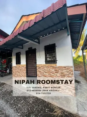 a building with a sign that reads nipah roosteway at NIPAH ROOMSTAY PARIT BUNTAR in Parit Buntar