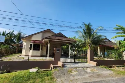 a small house with a gate in front of it at Adam Homestay in Ipoh
