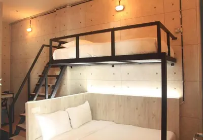 a room with two bunk beds in a room at Merge Summit by Secoms in Teluk Intan