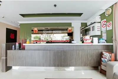 a fast food restaurant with a counter in a room at Sejati Hotel in Sitiawan