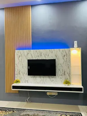 a flat screen tv sitting on top of a wall at SRS WIN Homestay in Sungai Petani