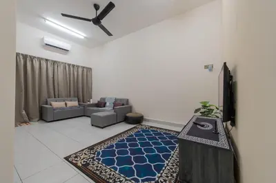 a living room with a couch and a table at Zai Ham Homestay in Pusing