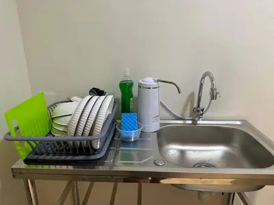 a kitchen sink with a dish rack next to it at CEO7 Duplex Business Suite#Disneys HS#USM#Pisa#Pantai Hospital in Bayan Lepas