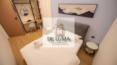 a room with a bed with a sign that reads de umma at DeLuma-Lebuh Acheh in George Town
