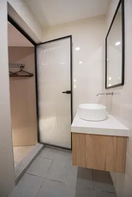 a bathroom with a sink and a shower at DeLuma-Lebuh Acheh in George Town