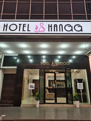 a hotel and image sign in front of a building at Shangg INN in Ipoh