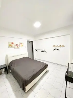 a bedroom with a bed in a white room at EC12-Georgetown-3room-PrivateHouse in Jelutong