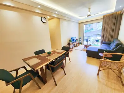 a living room with a table and chairs and a couch at IPOH The COVE at Ipoh Garden East 7 PAX Cozy Fully Air-Con in Ipoh