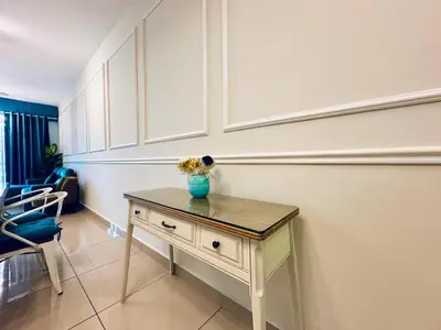 a room with a table with a vase on it at The Majestic-Loft De Tel in Ipoh
