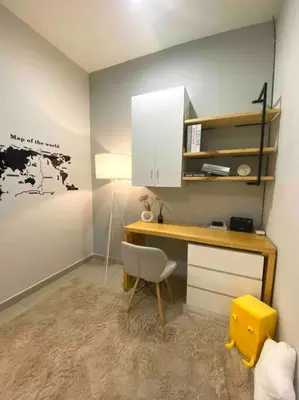 a room with a desk with a chair and a lamp at Stylish Cozy House Near Ipoh Lost World Tambun in Kampong Batu Lapan