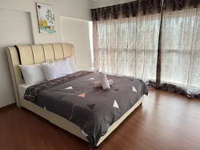 a bedroom with a bed with a teddy bear on it at CEO9 Duplex Premier 6 Pax Suite#Disneys HS #PISA #USM #Pantai Hospital in Bayan Lepas