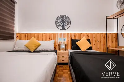 two beds sitting next to each other in a bedroom at Ipoh 188 Private Pool Mansion by Verve 30 pax EECH119 in Ipoh